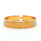 Hermès Clic H Patterned White Enamel Gold Bracelet