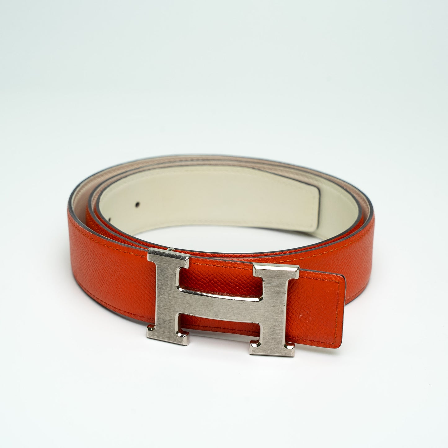 Hermès Reversible H Buckle Belt in Orange and White Leather