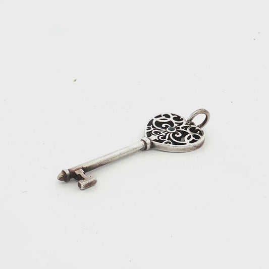 Elegant Tiffany & Co. Heart Key Pendant in Sterling Silver