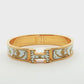 Hermès Clic H Patterned White Enamel Gold Bracelet